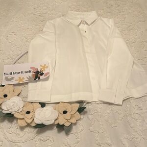 White blouse w/gold buttons & zippered detail on the back. Never worn. Size S